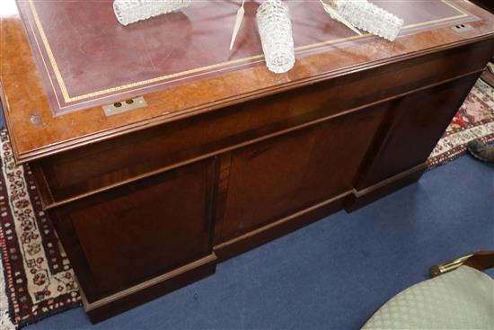 A Georgian style banded yew pedestal desk inset red/brown skiver W.152cm